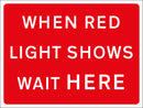 Temporary Sign - WHEN RED LIGHT SHOWS WAIT HERE